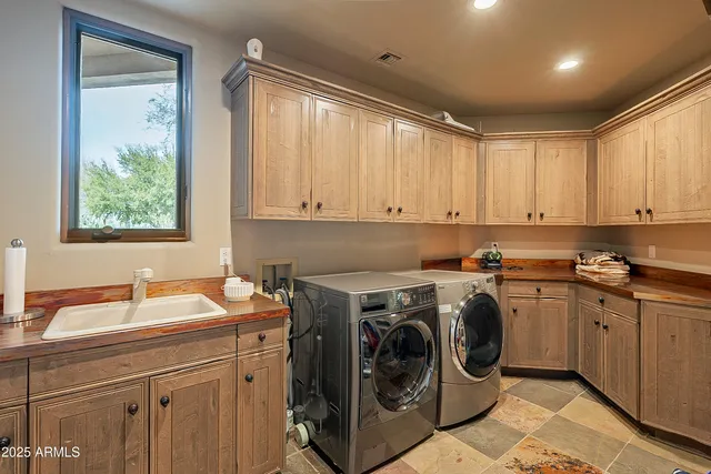a living room with furniture a table and a large window
