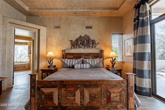 a living room with furniture a wooden floor and next to a window