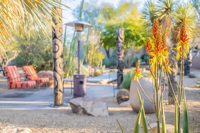 a bed room with a bed and a chair