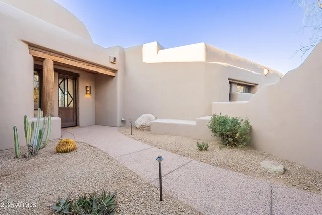 a terrace with outdoor seating and a garden