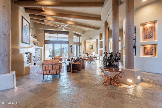 a living room with furniture and next to a window