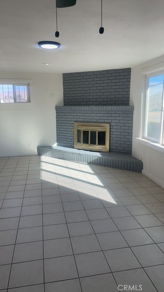 15313 Center Street Victorville, CA 92395 - Photo 4 of 11 a living room with a fireplace