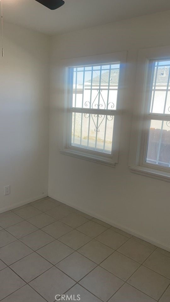 15313 Center Street Victorville, CA 92395 - Photo 5 of 11 an empty room with a window