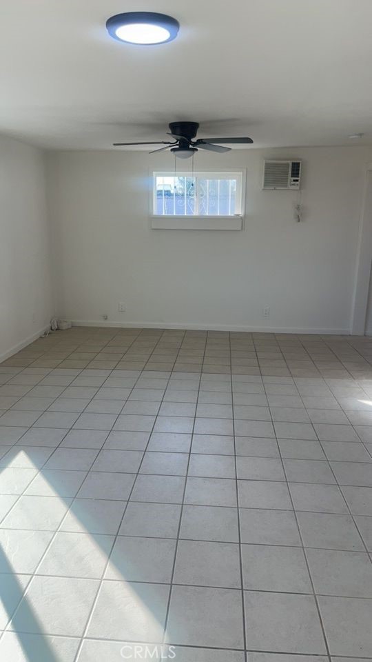 15313 Center Street Victorville, CA 92395 - Photo 8 of 11 a view of an empty room with a window