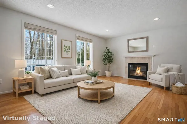 a living room with furniture and a fireplace