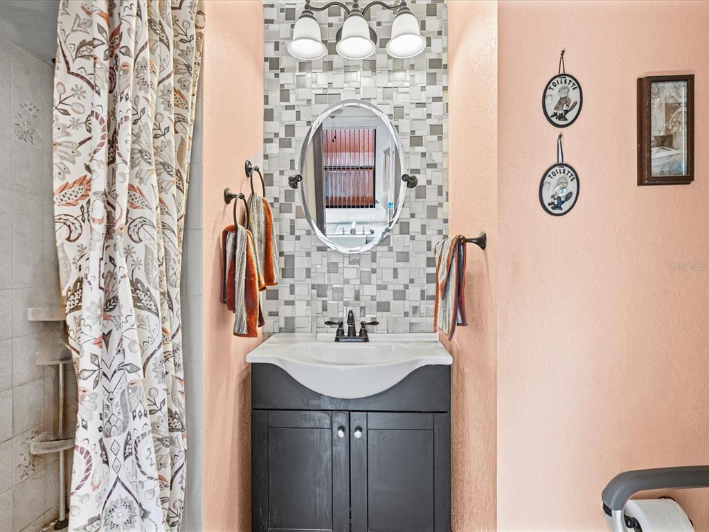 18824 Parade Road Hudson, FL 34667 - Photo 11 of 29 a bathroom with a sink and a mirror