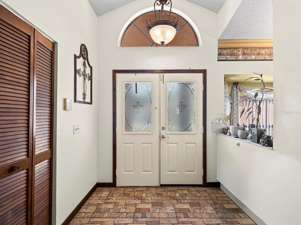 18824 Parade Road Hudson, FL 34667 - Photo 21 of 29 a view of a livingroom with wooden floor and a window