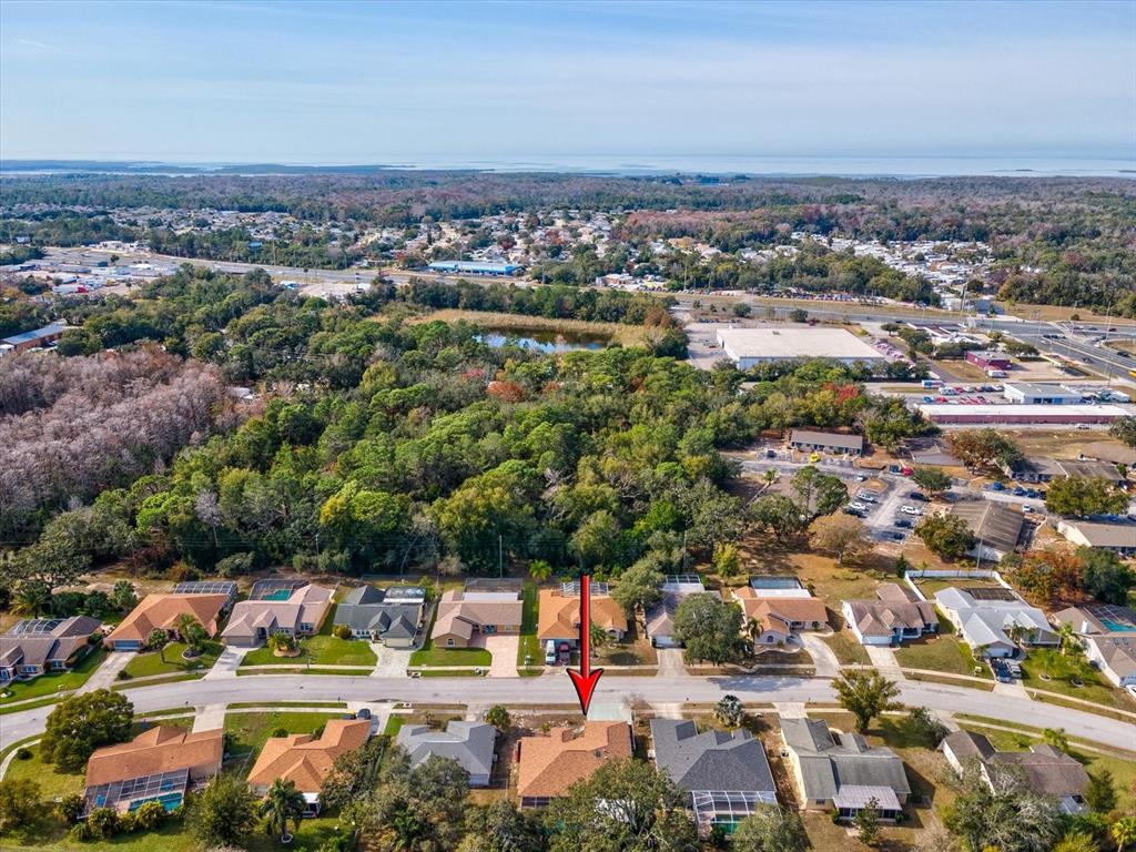 18824 Parade Road Hudson, FL 34667 - Photo 30 of 38 an aerial view of residential houses with outdoor space