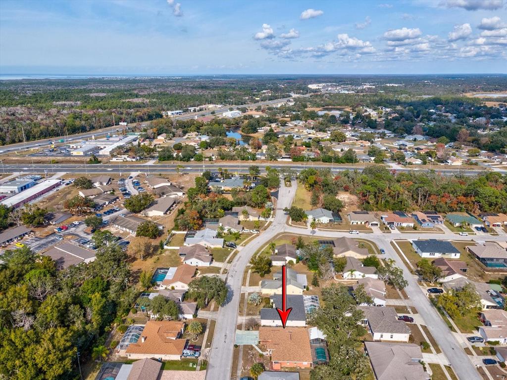 18824 Parade Road Hudson, FL 34667 - Photo 36 of 38 an aerial view of residential building and lake