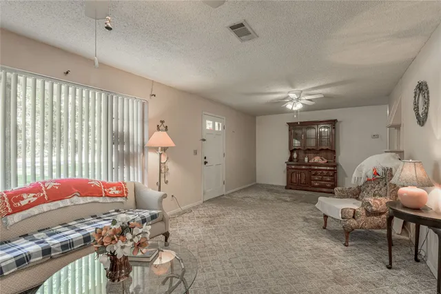 a bed room with a bed and a chair