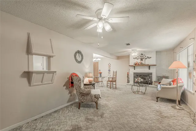 a living room with furniture a table and decor