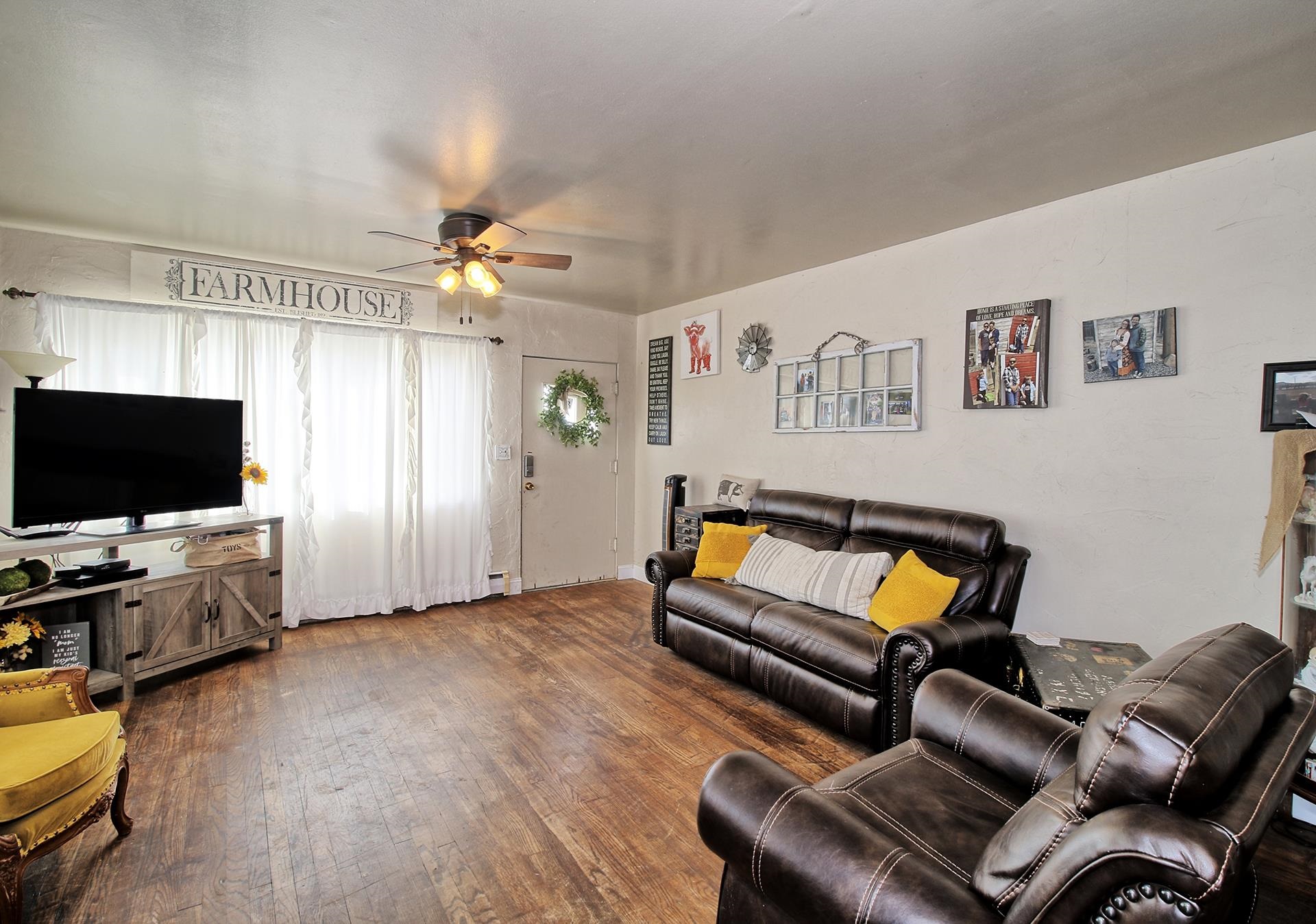 875 21 Road Fruita, CO 81521 - Photo 4 of 30 a living room with furniture and a flat screen tv
