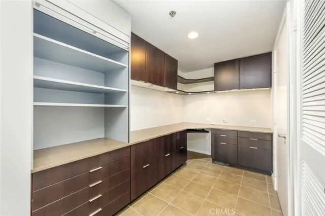 a kitchen with cabinets a sink and appliances