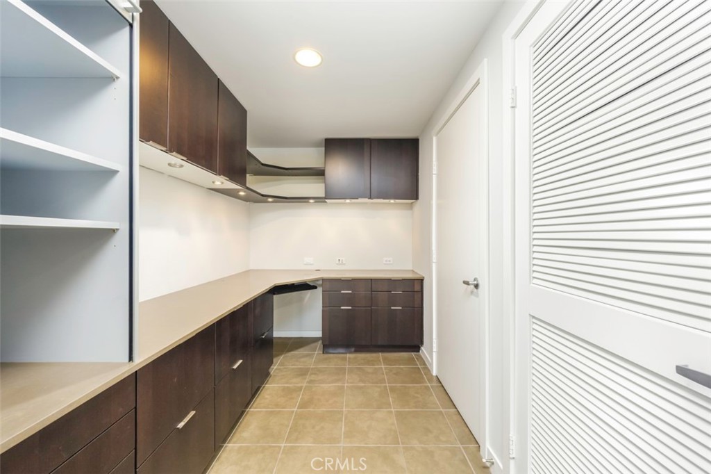 411 West Seaside Way, Unit 703 Long Beach, CA 90802 - Photo 12 of 52 a kitchen with cabinets and window