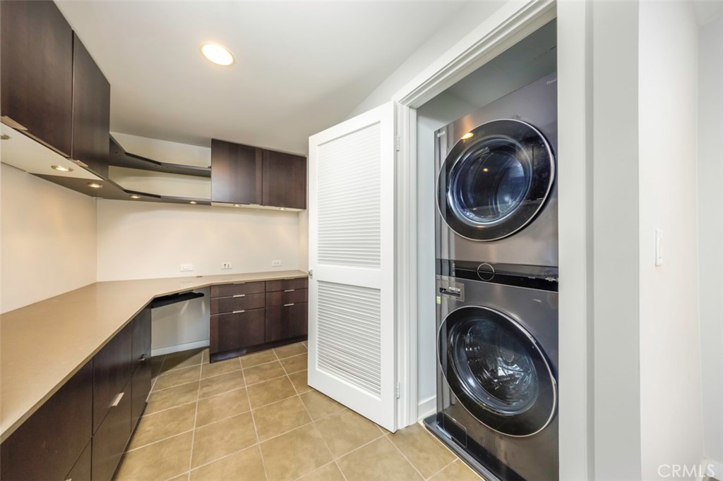 411 West Seaside Way, Unit 703 Long Beach, CA 90802 - Photo 13 of 52 a view of a kitchen with washer and dryer