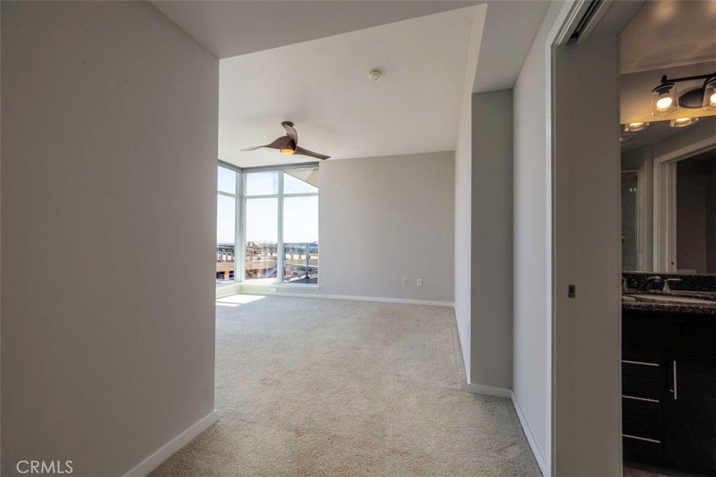 411 West Seaside Way, Unit 703 Long Beach, CA 90802 - Photo 17 of 52 a view of an empty room with a fireplace