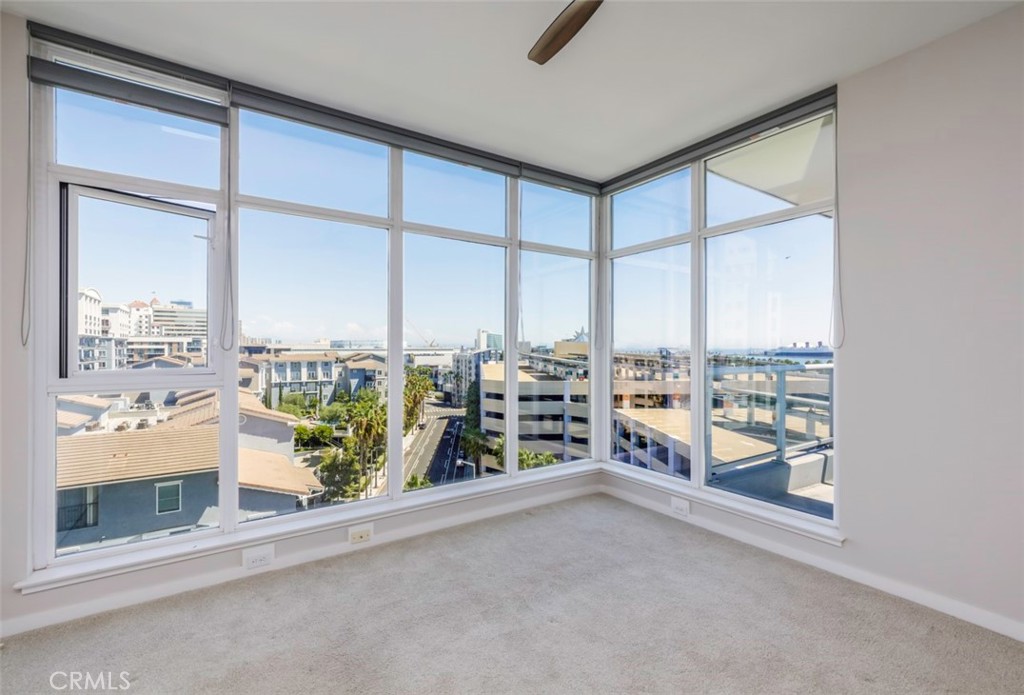411 West Seaside Way, Unit 703 Long Beach, CA 90802 - Photo 19 of 52 an empty room with sliding glass door and mountain view