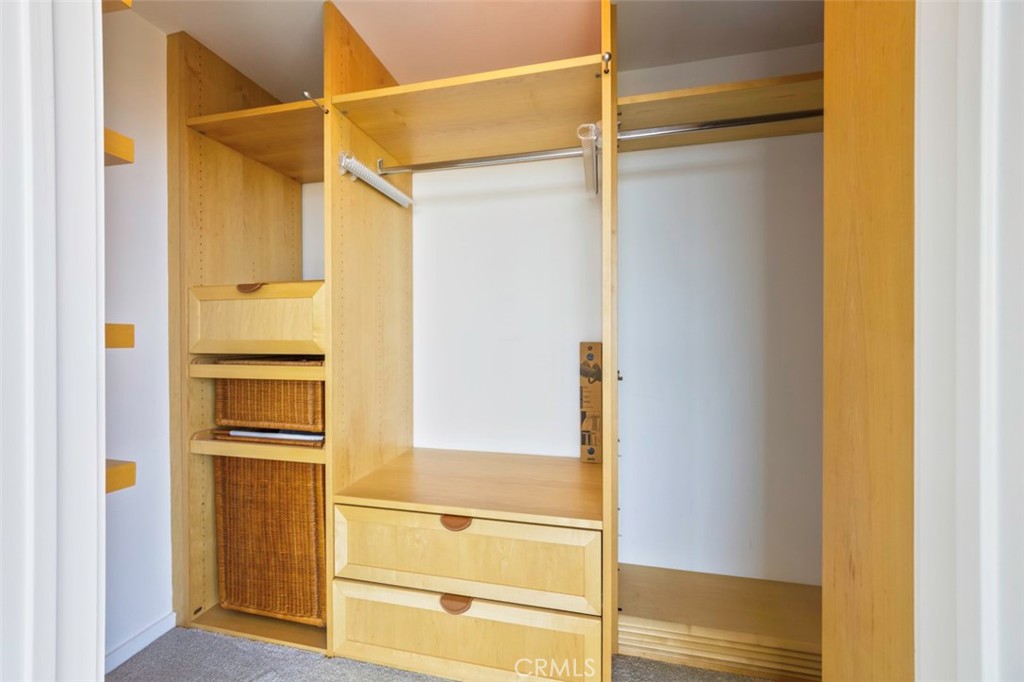411 West Seaside Way, Unit 703 Long Beach, CA 90802 - Photo 22 of 52 a view of walk in closet with empty racks