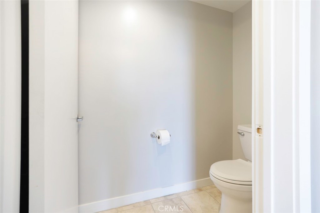 411 West Seaside Way, Unit 703 Long Beach, CA 90802 - Photo 24 of 52 a white toilet sitting next to a shower