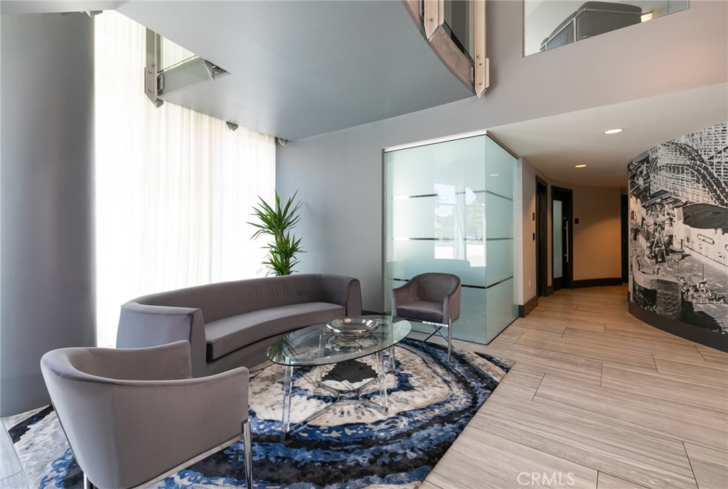 411 West Seaside Way, Unit 703 Long Beach, CA 90802 - Photo 36 of 52 a living room with furniture and a table