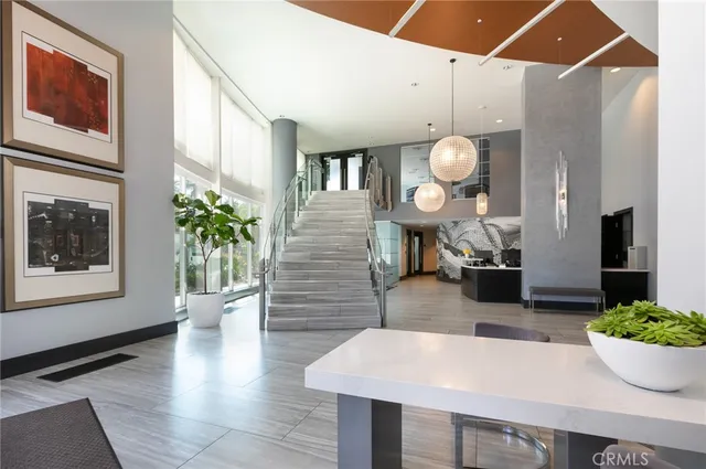 a view of a dining room with furniture and a flat screen tv