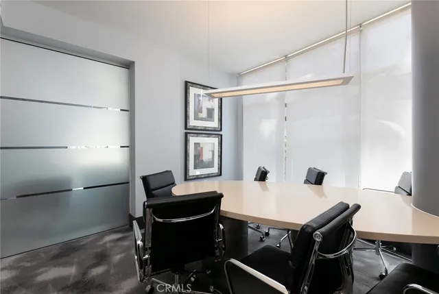 a large kitchen with a table and chairs