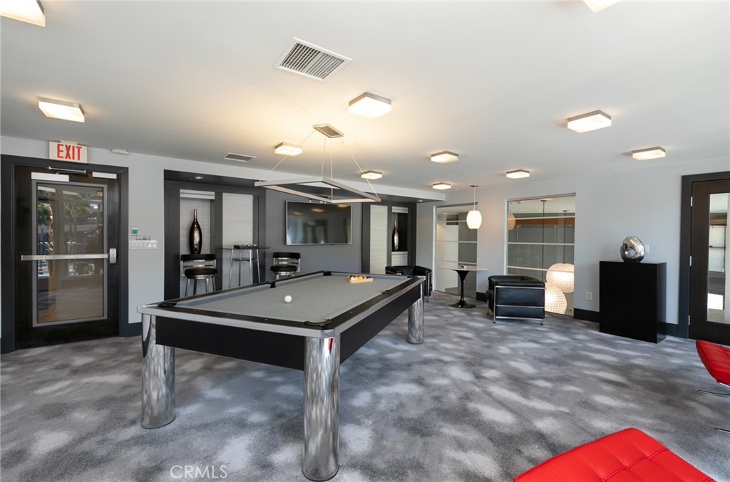 411 West Seaside Way, Unit 703 Long Beach, CA 90802 - Photo 43 of 52 a room with lots of table and chairs