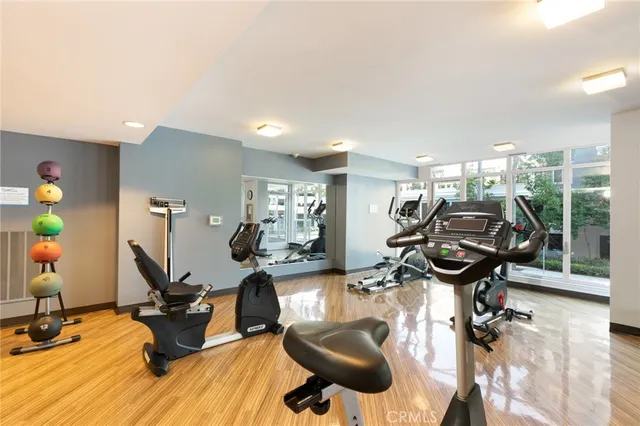 a view of a patio with couches table and chairs with potted plants