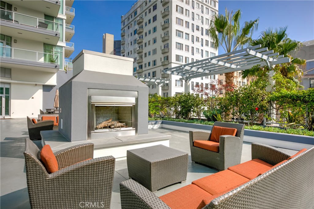 411 West Seaside Way, Unit 703 Long Beach, CA 90802 - Photo 48 of 52 a view of a patio with couches table and chairs with potted plants