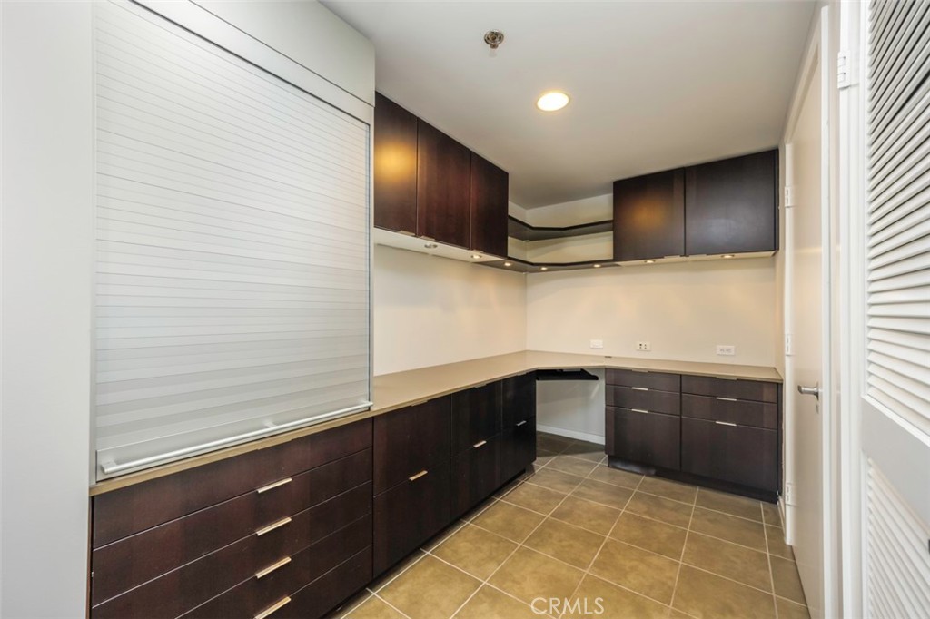 411 West Seaside Way, Unit 703 Long Beach, CA 90802 - Photo 9 of 52 a kitchen with stainless steel appliances granite countertop a sink and cabinets
