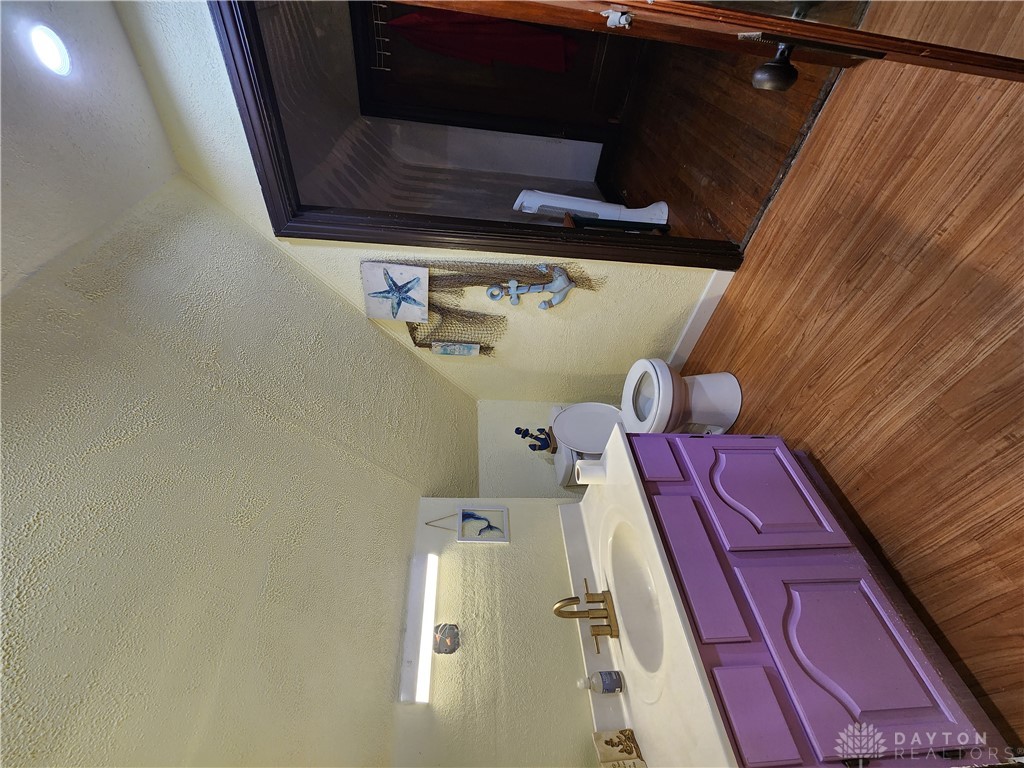 1436 Ruskin Road Dayton, OH 45406 - Photo 10 of 29 This cozy second floor bathroom features a vanity with ample storage and durable wood flooring.