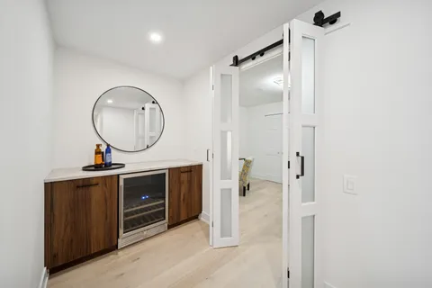 a bathroom with a sink a vanity and a mirror
