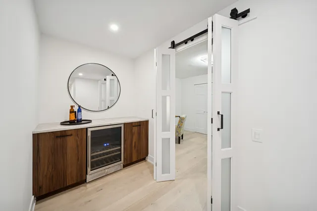 a bathroom with a sink a vanity and a mirror