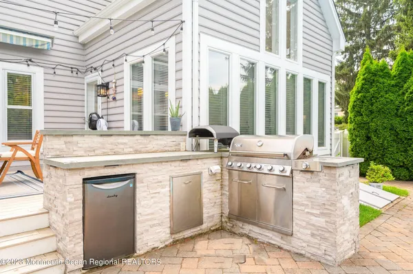 a view of a kitchen with a stove and a sink