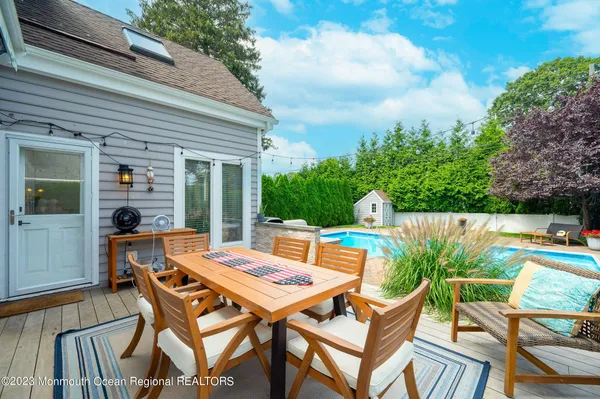 a patio with table and chairs