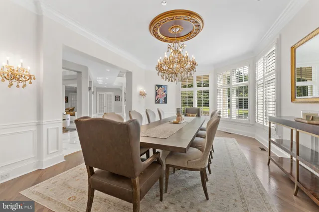 a living room with furniture and large windows