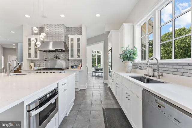 a spacious bedroom with a large bed and wooden floor