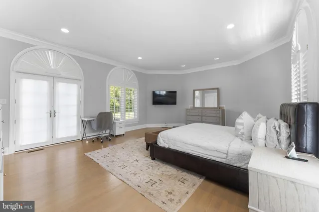 a view of a house with swimming pool and sitting area