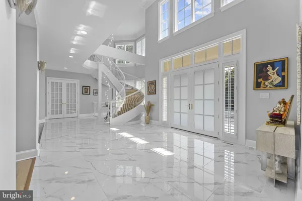 a kitchen with a dining table chairs and cabinets