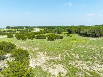 a view of outdoor space with trees all around