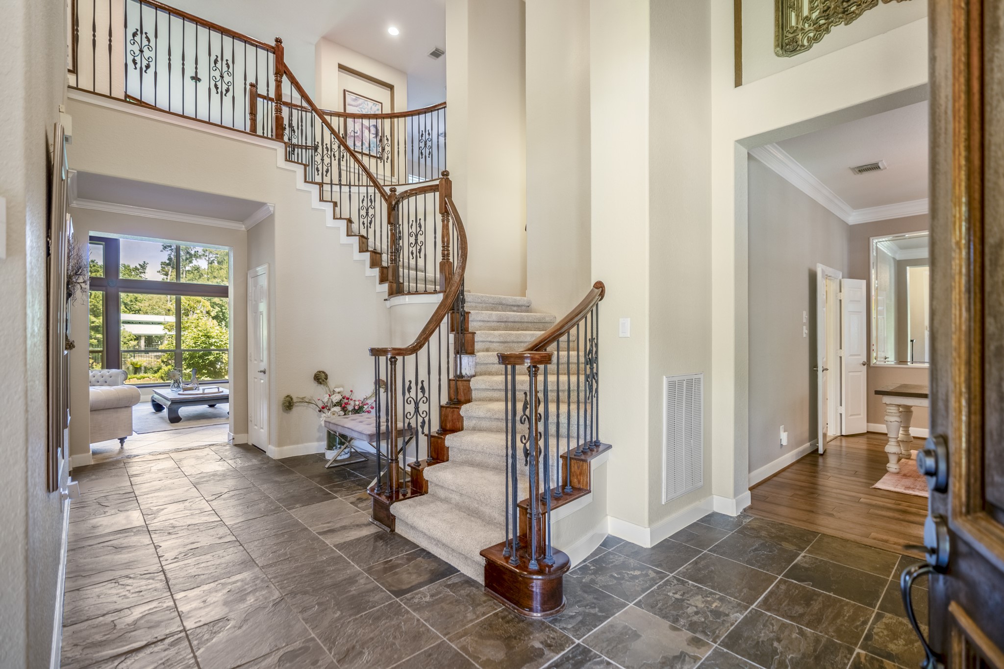 67 North Pentenwell Circle Spring, TX 77382 - Photo 4 of 50 a view of entryway with wooden floor and a potted plant