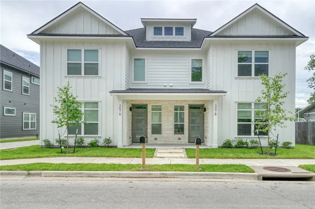 a house with a yard and plants