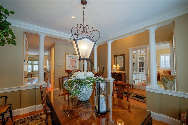 76 Greensward Road Mashpee, MA 02649 - Photo 11 of 24 a view of a dining room with furniture window and wooden floor
