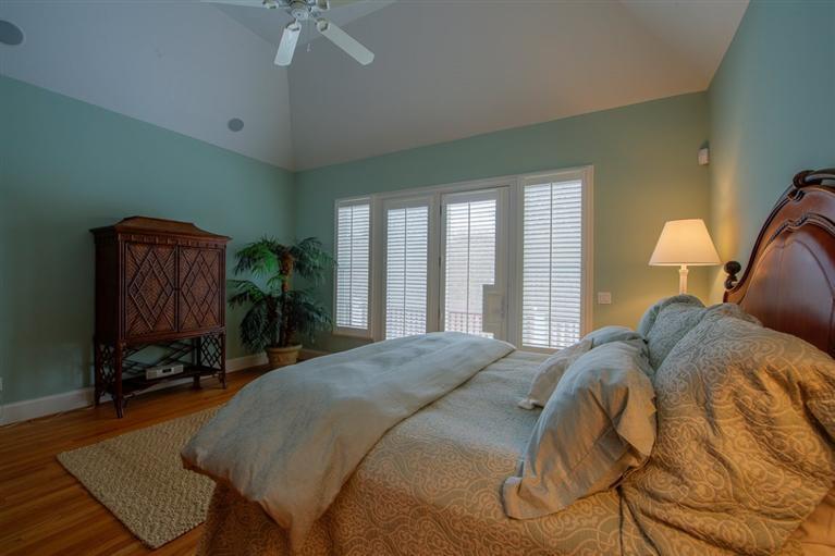 76 Greensward Road Mashpee, MA 02649 - Photo 14 of 24 a bed sitting in a bedroom next to a window