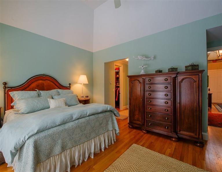 76 Greensward Road Mashpee, MA 02649 - Photo 15 of 24 a bedroom with a bed and a dresser