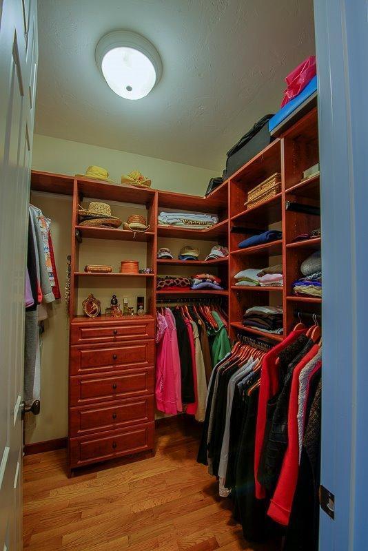 76 Greensward Road Mashpee, MA 02649 - Photo 16 of 24 a view of walk in closet with clothes and shoes
