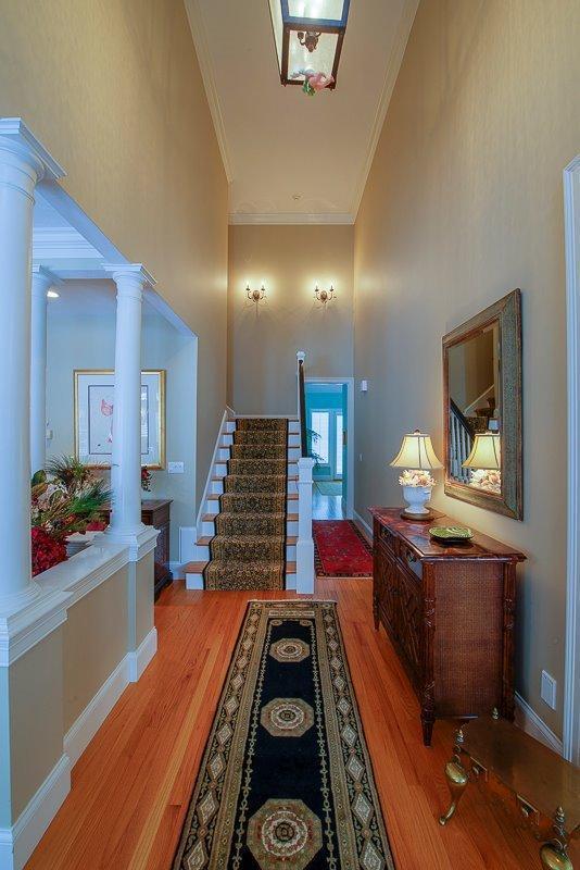 76 Greensward Road Mashpee, MA 02649 - Photo 19 of 24 a living room with furniture and a wooden floor