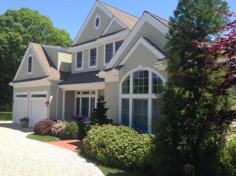 76 Greensward Road Mashpee, MA 02649 - Photo 2 of 24 a view of a white house next to a yard