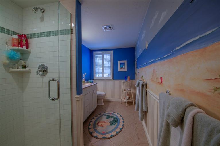 76 Greensward Road Mashpee, MA 02649 - Photo 21 of 24 a bathroom with a shower a toilet and a shower