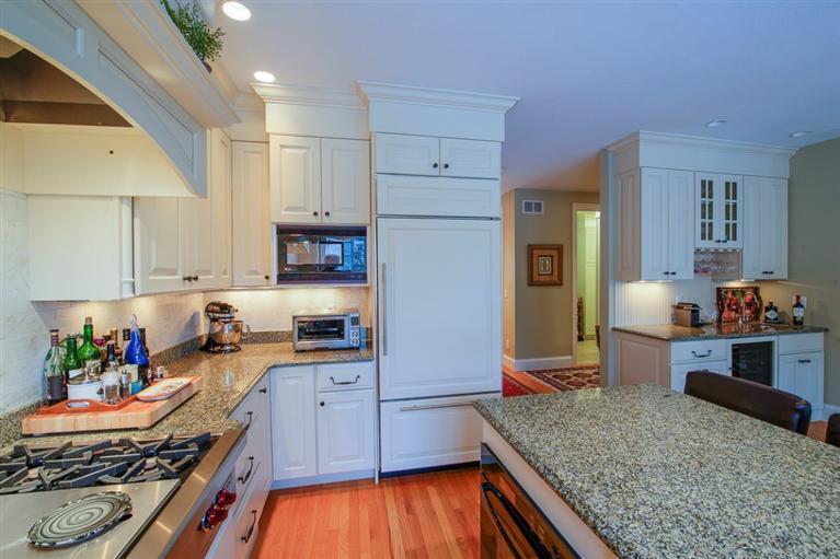 76 Greensward Road Mashpee, MA 02649 - Photo 4 of 24 a kitchen with stainless steel appliances granite countertop a stove refrigerator and cabinets